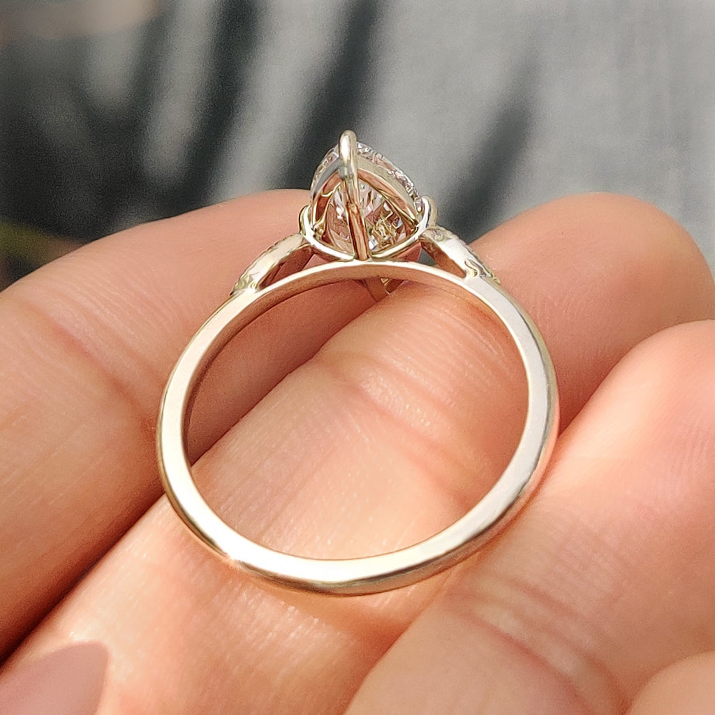 Marquise Cut Diamond Ring with Round Side Stones