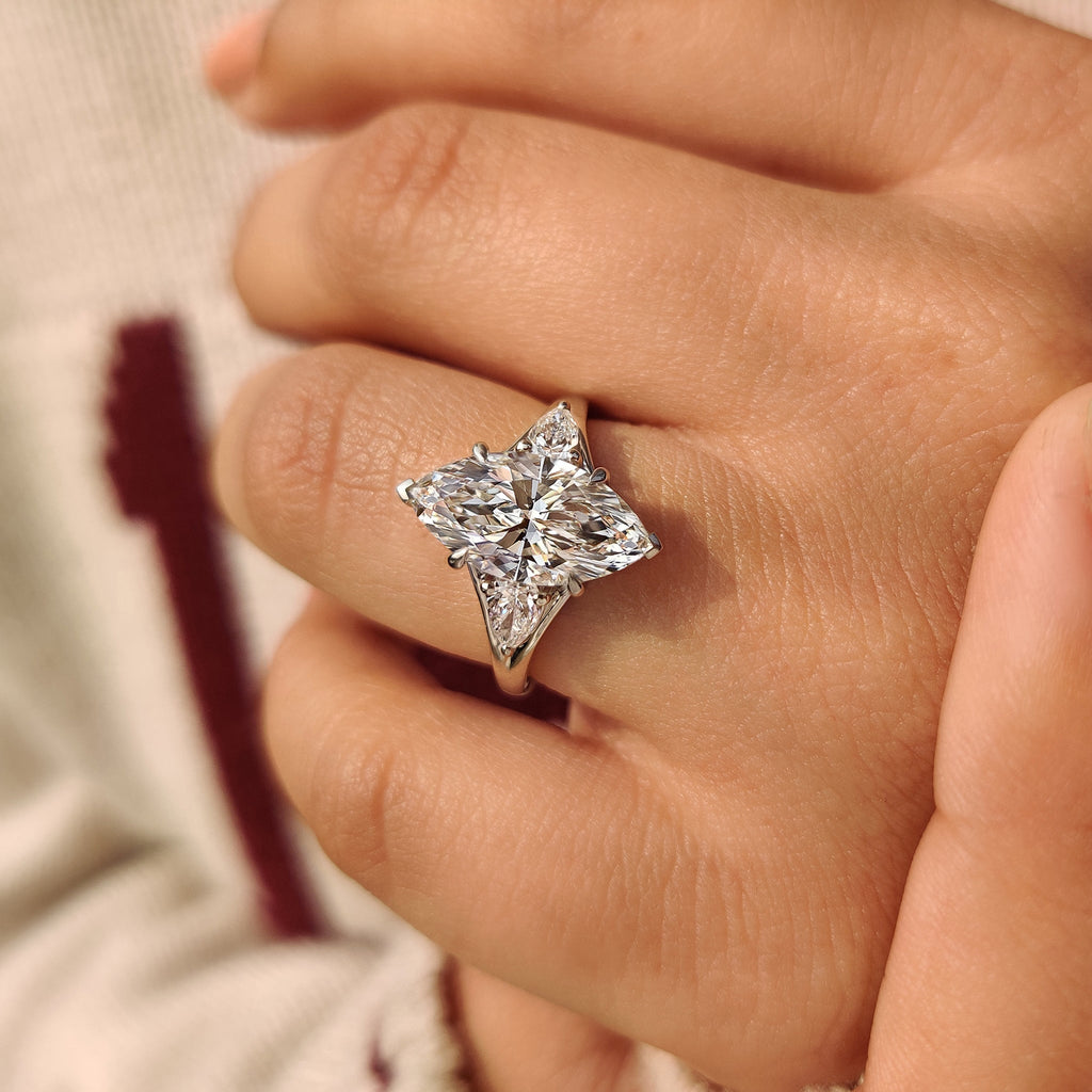 Three Stone Marquise Diamond Ring with Pear Side Diamond