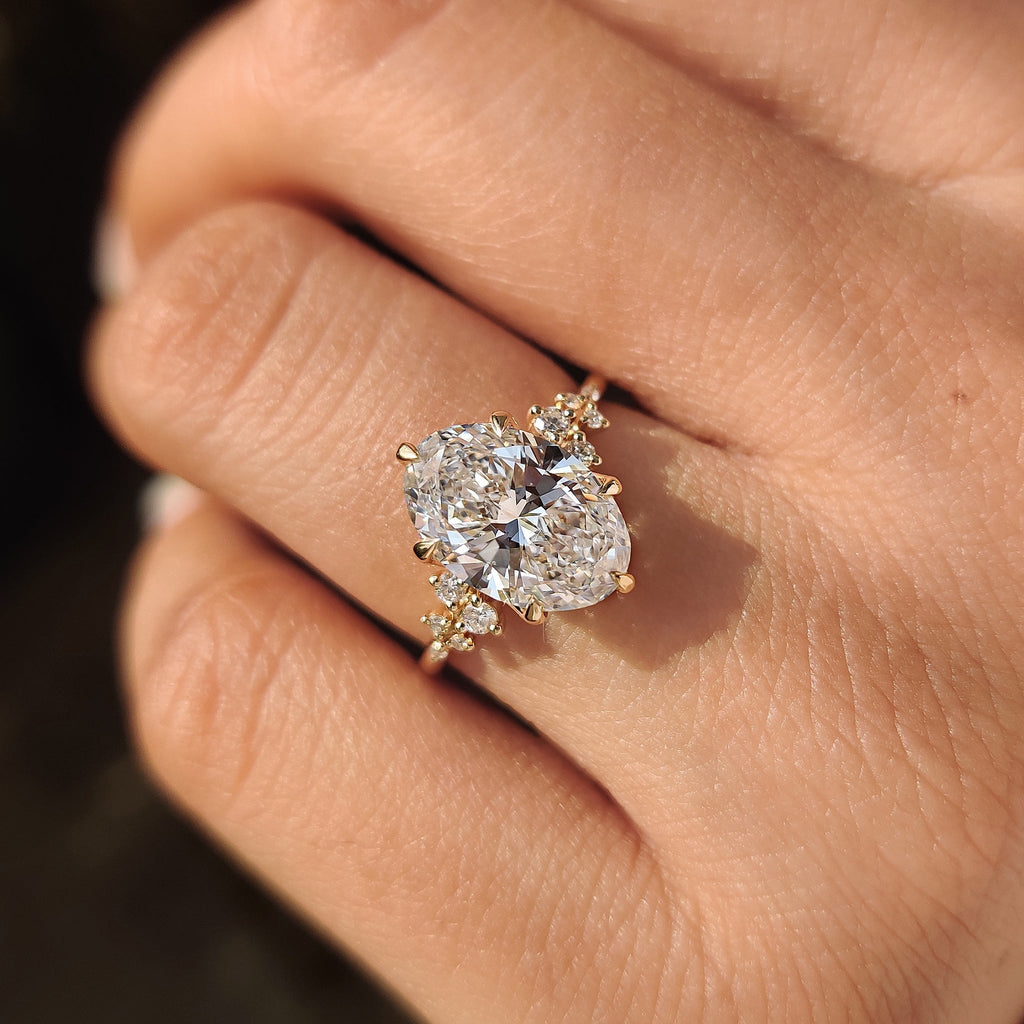 Oval Diamond Ring With Round Side Stones