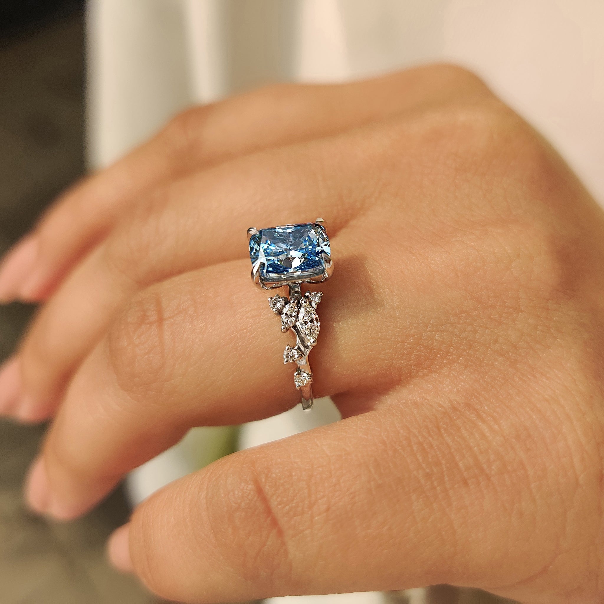 Blue Cushion Cut Diamond Ring in Cluster Setting