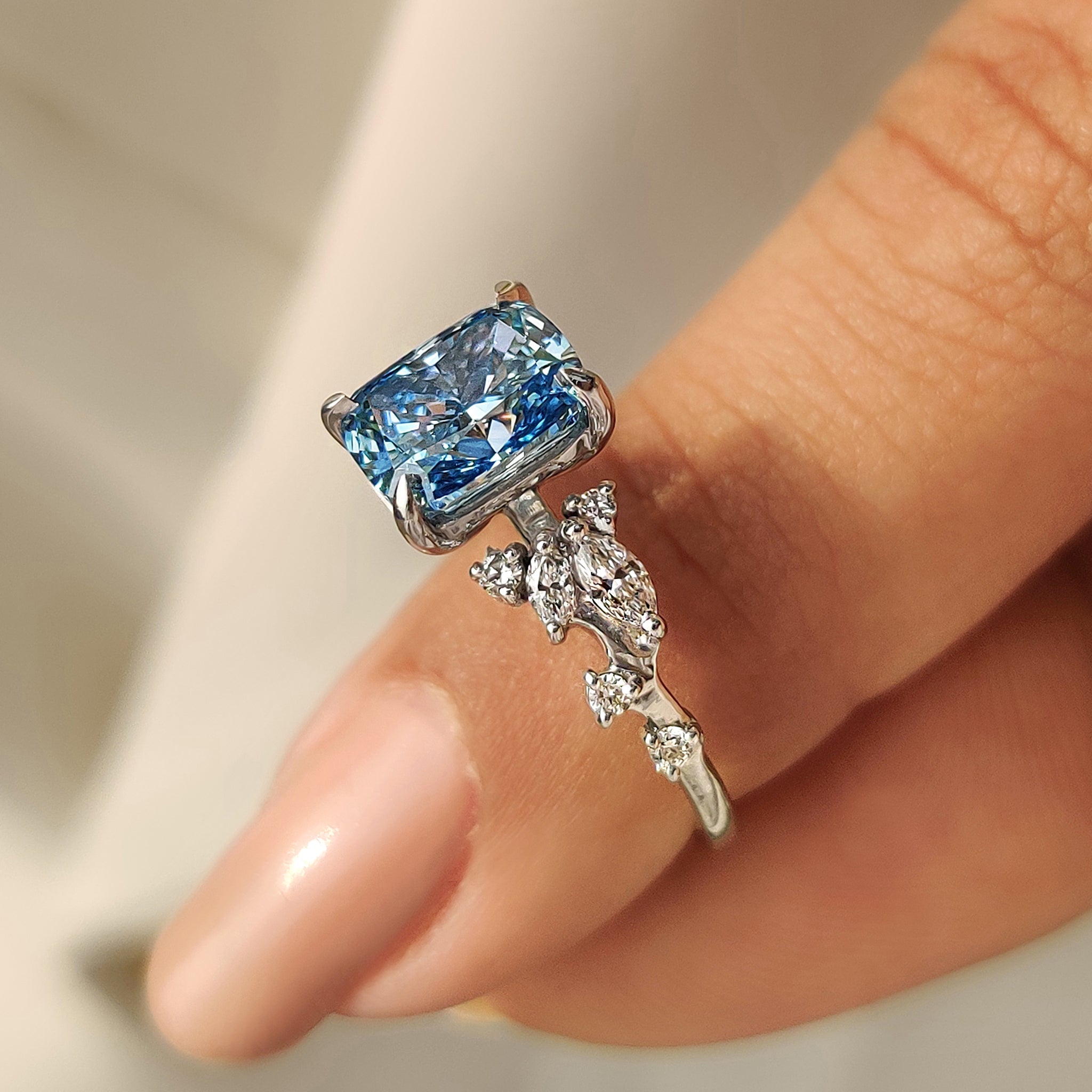 Blue Cushion Cut Diamond Ring in Cluster Setting