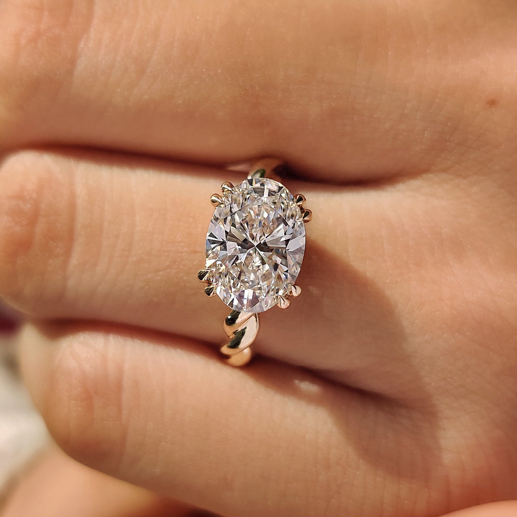 Solitaire Oval Cut Engagement Ring In East To West Setting