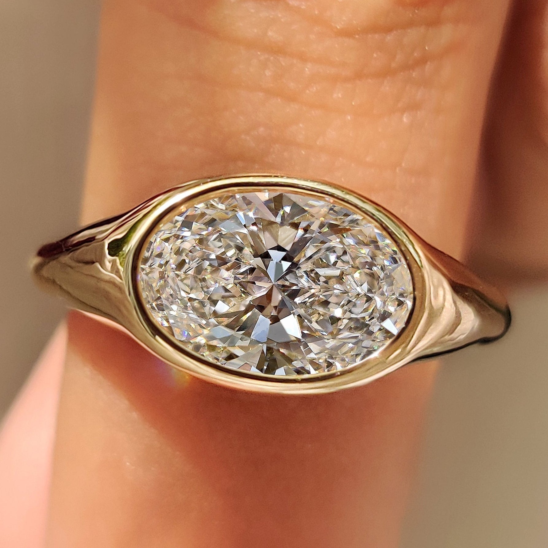 Solitaire Oval Diamond Ring in Bezel Setting Main image