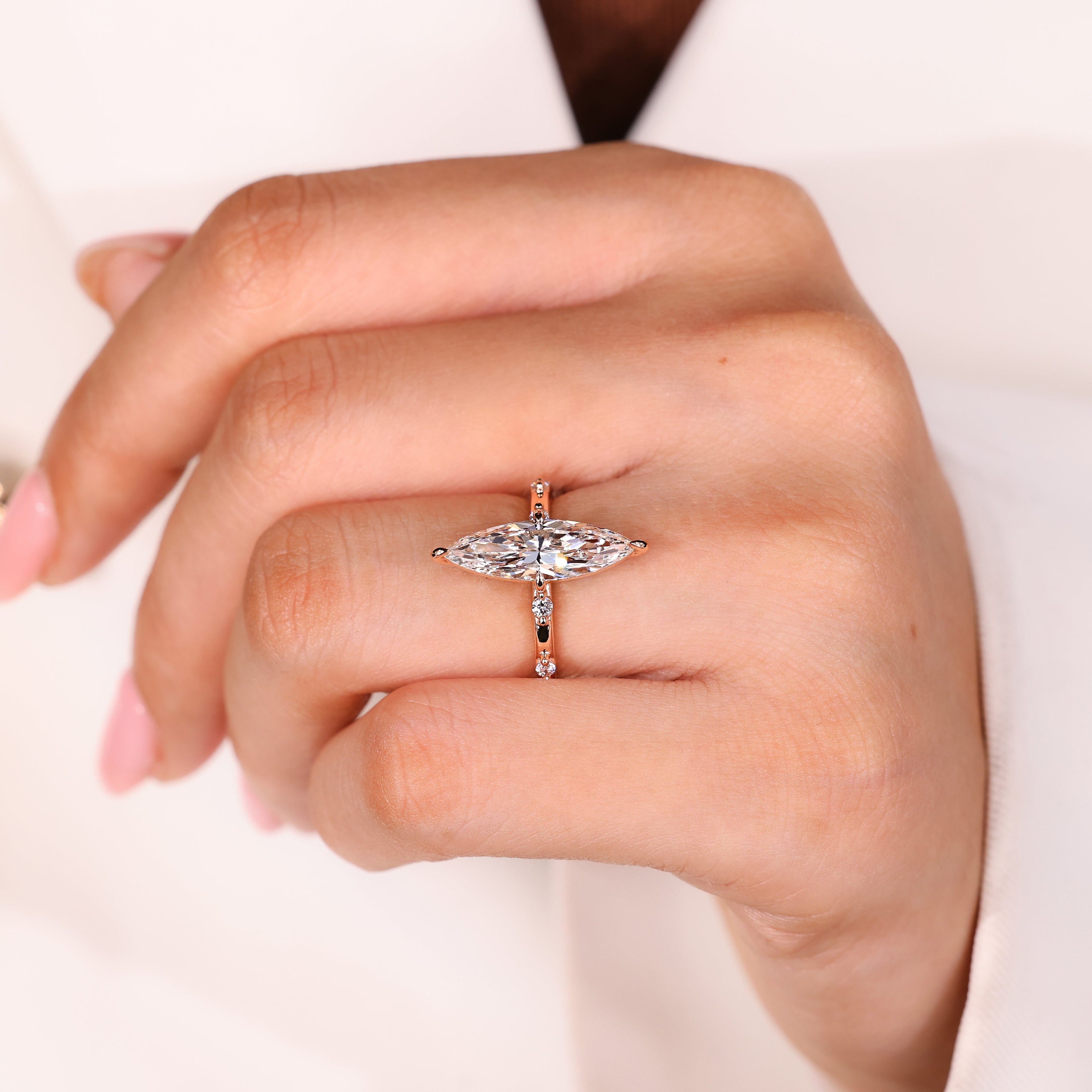 Elongated Marquise Engagement Ring In Distance Pave Style