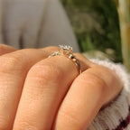 Three Stone Style Oval Cut Engagement Ring with Round Side Stone