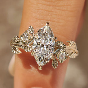 Nature Inspired Marquise Cut Engagement Ring with Round Side Stone