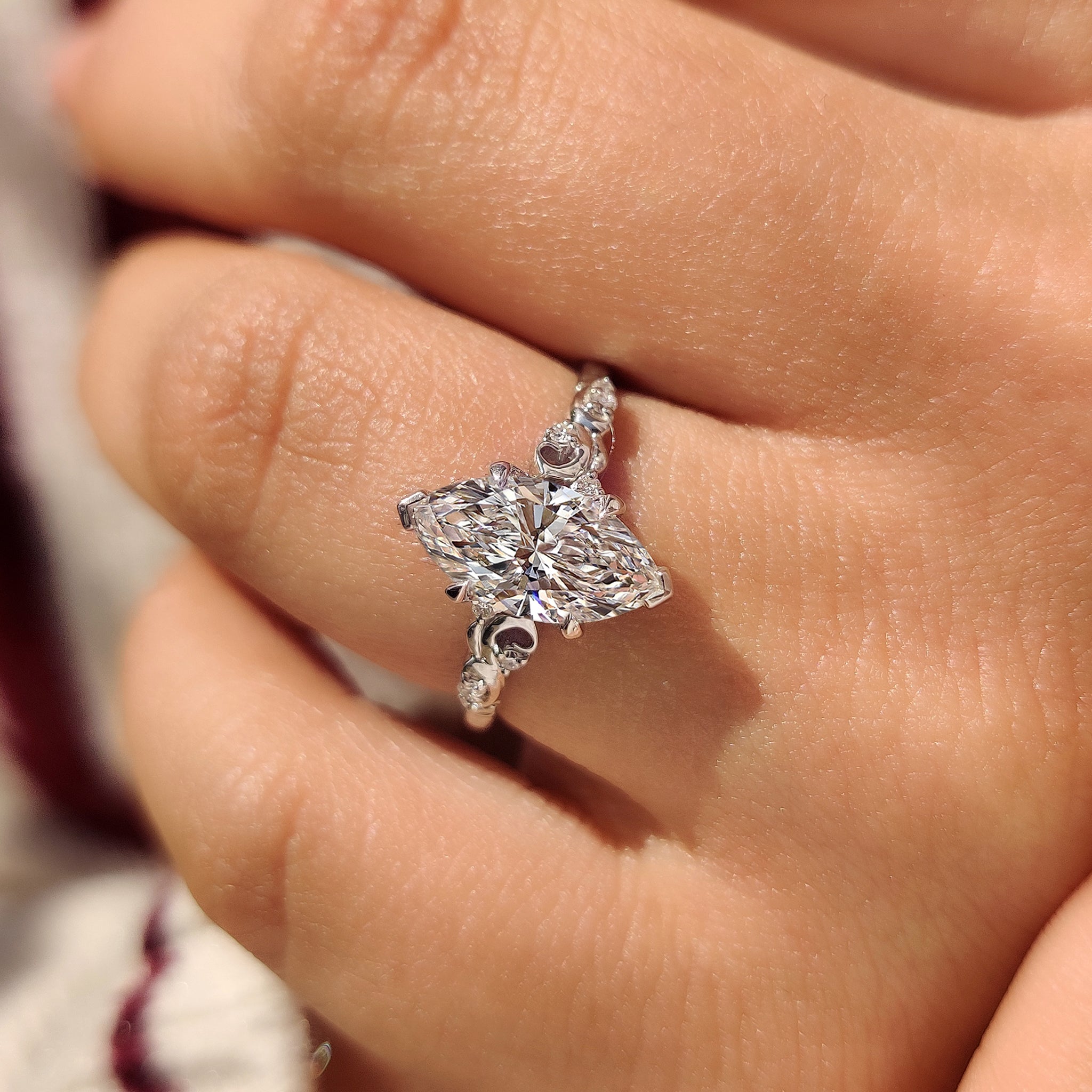 Marquise Cut Diamond Ring in Side Stone Style