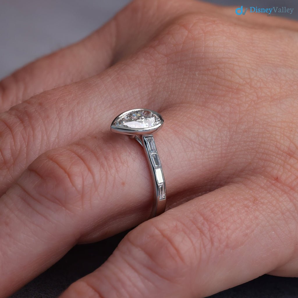 Pear Diamond Engagement Ring with Baguettes - Penelope: Bezel Set with Trellis and Channel Set - DisneyValley 