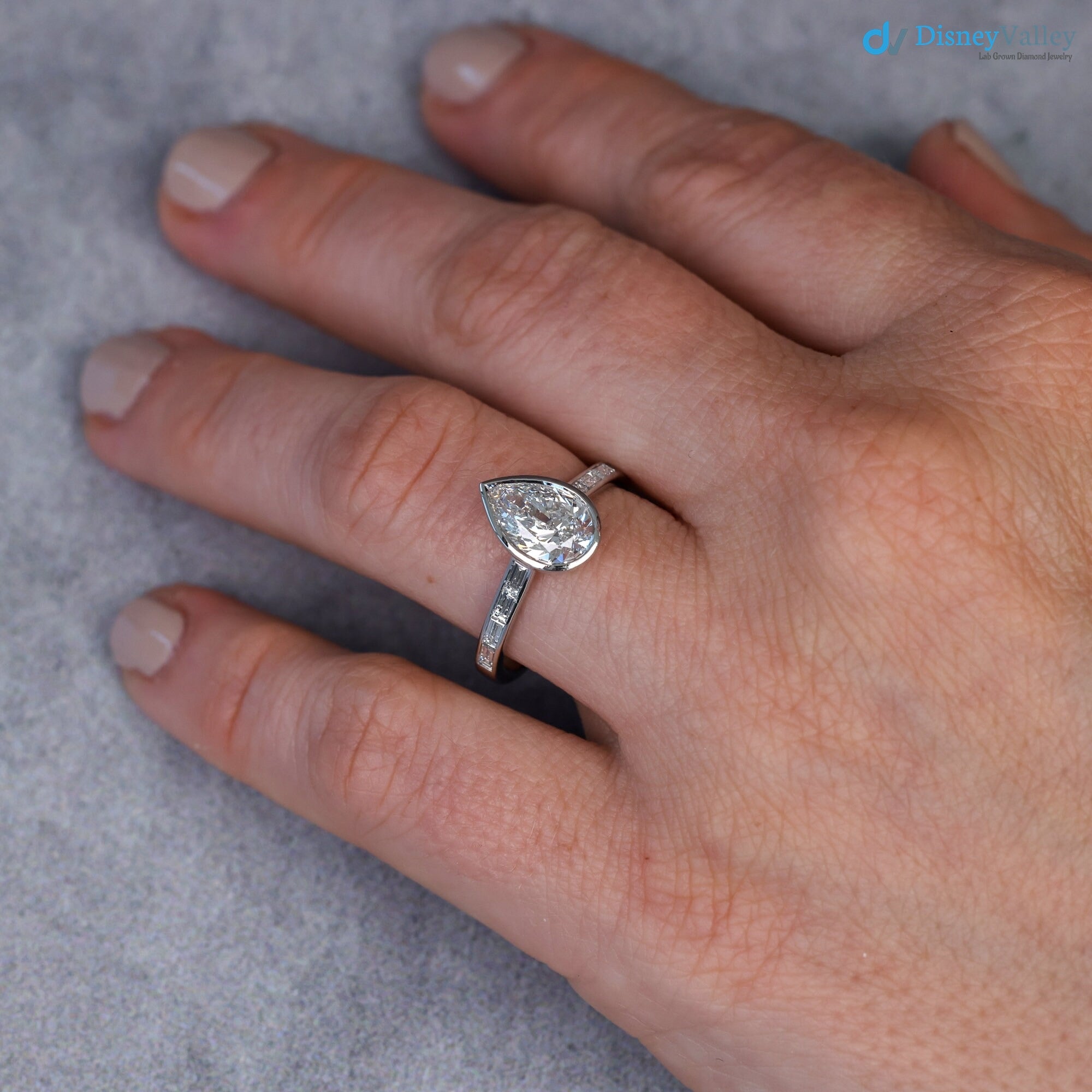 Pear Diamond Engagement Ring with Baguettes - Penelope: Bezel Set with Trellis and Channel Set - DisneyValley 