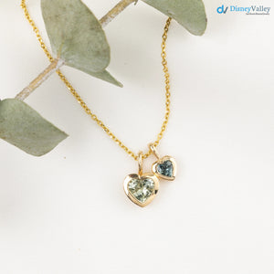Collar y cadena tipo cable con diamantes y corazón de zafiro verde