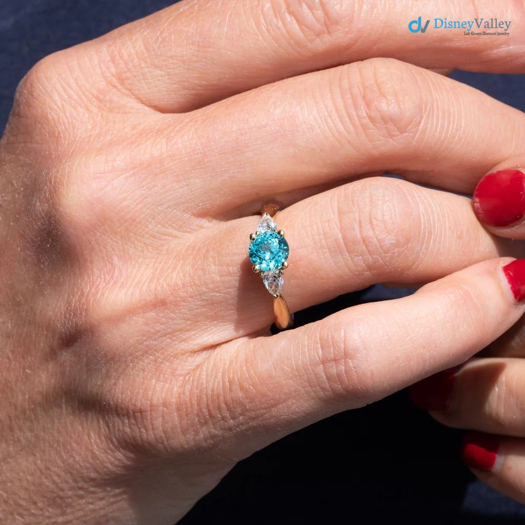 The Sophia Ring 1.98ct Brilliant Cut Paraiba Tourmaline Trilogy engagement ring