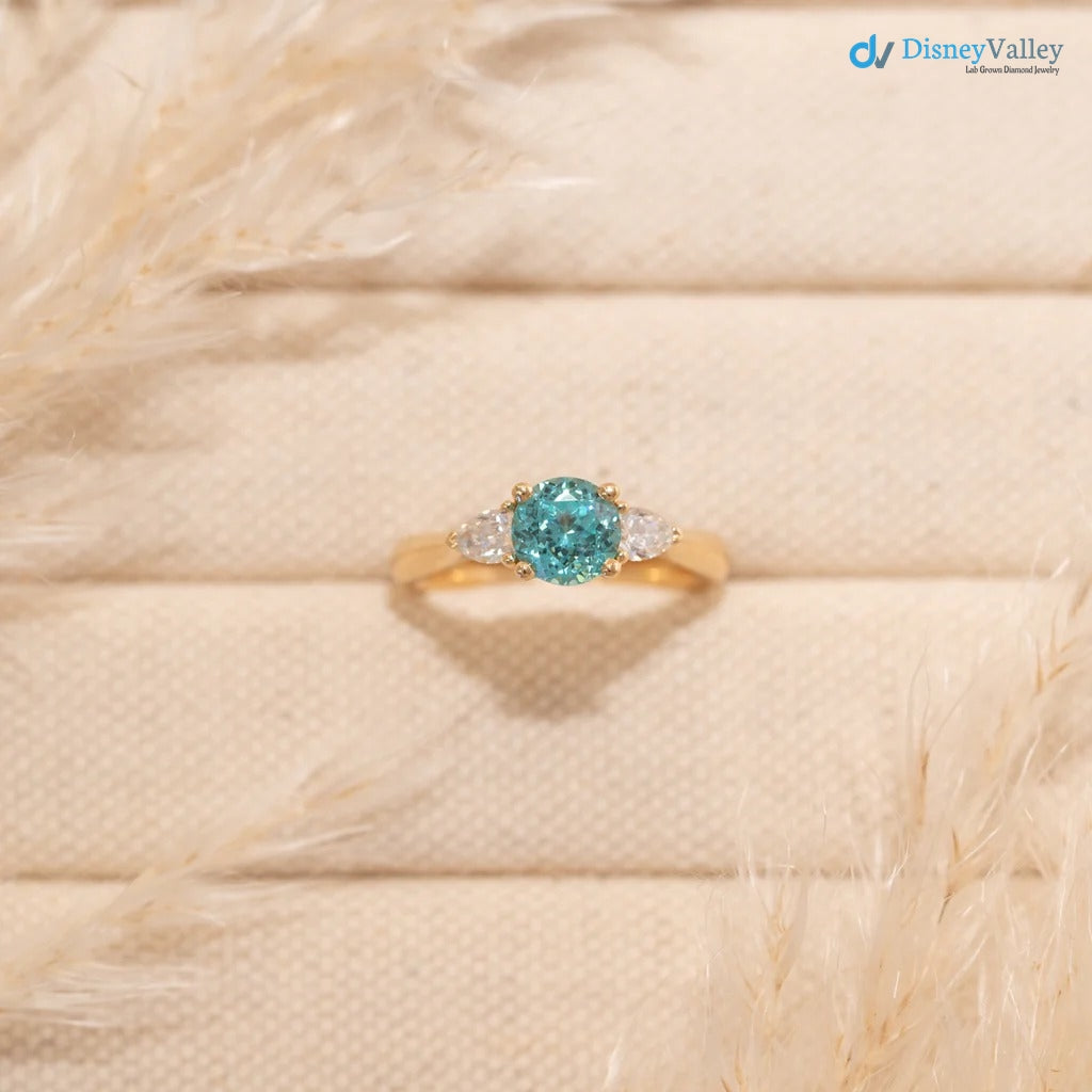 The Sophia Ring 1.98ct Brilliant Cut Paraiba Tourmaline Trilogy engagement ring
