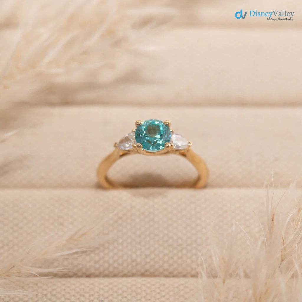 The Sophia Ring 1.98ct Brilliant Cut Paraiba Tourmaline Trilogy engagement ring