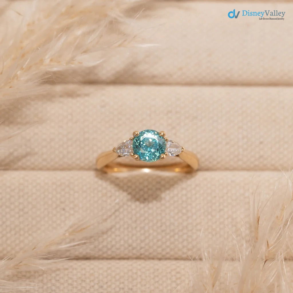 The Sophia Ring 1.98ct Brilliant Cut Paraiba Tourmaline Trilogy engagement ring