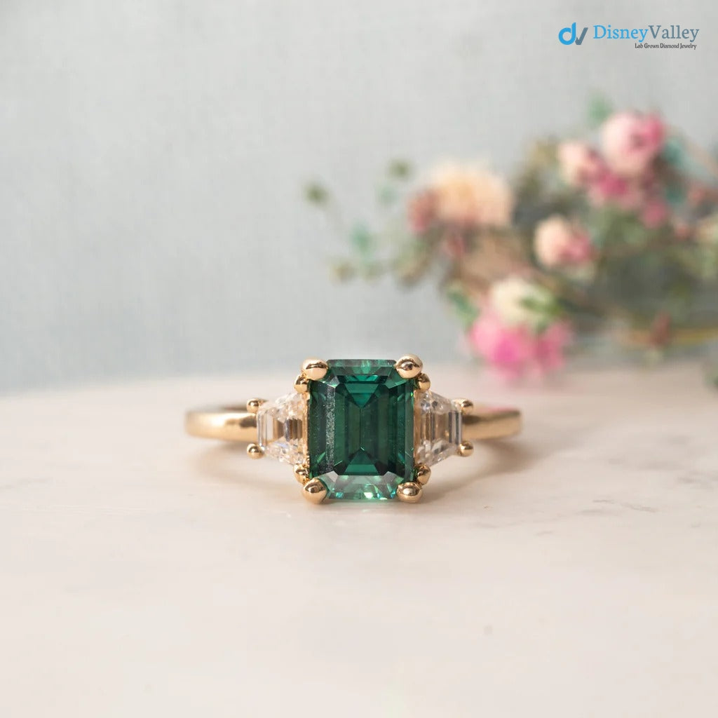 The Evelyn Ring 2.50ct Emerald Cut Green Trapezoid Lab Diamond Trilogy 9k Yellow Gold