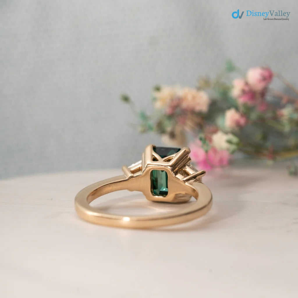 The Evelyn Ring 2.50ct Emerald Cut Green Trapezoid Lab Diamond Trilogy 9k Yellow Gold