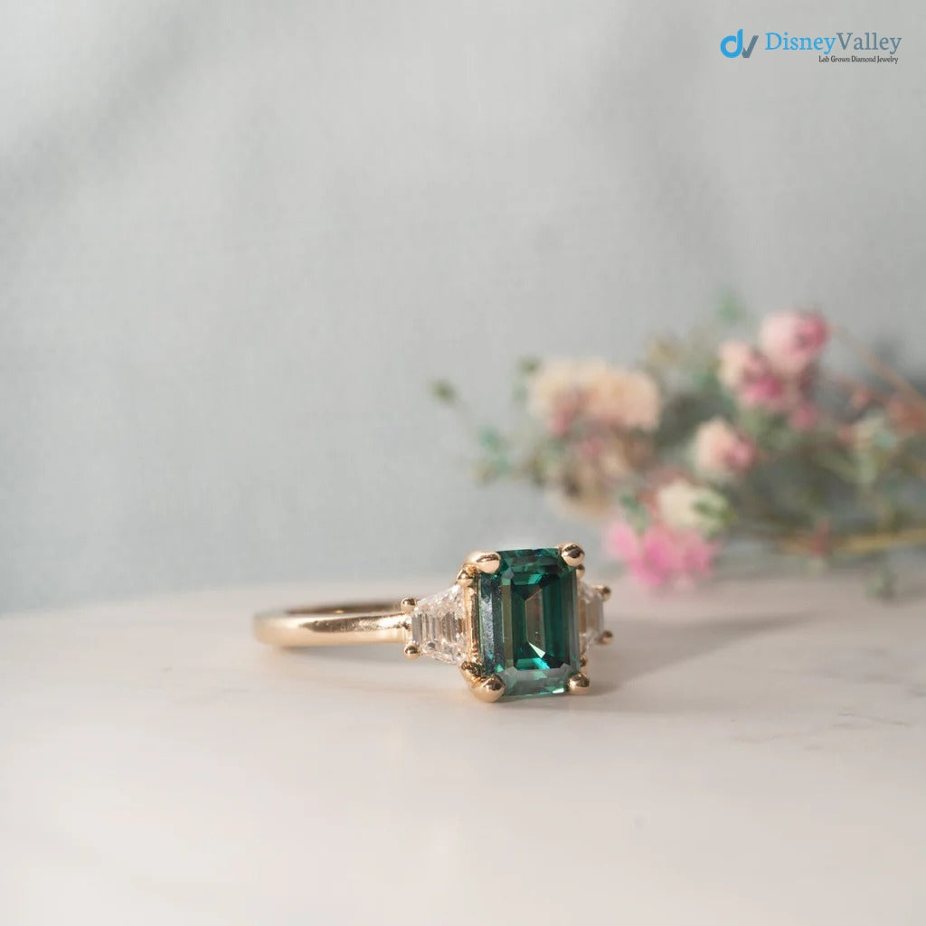 The Evelyn Ring 2.50ct Emerald Cut Green Trapezoid Lab Diamond Trilogy 9k Yellow Gold