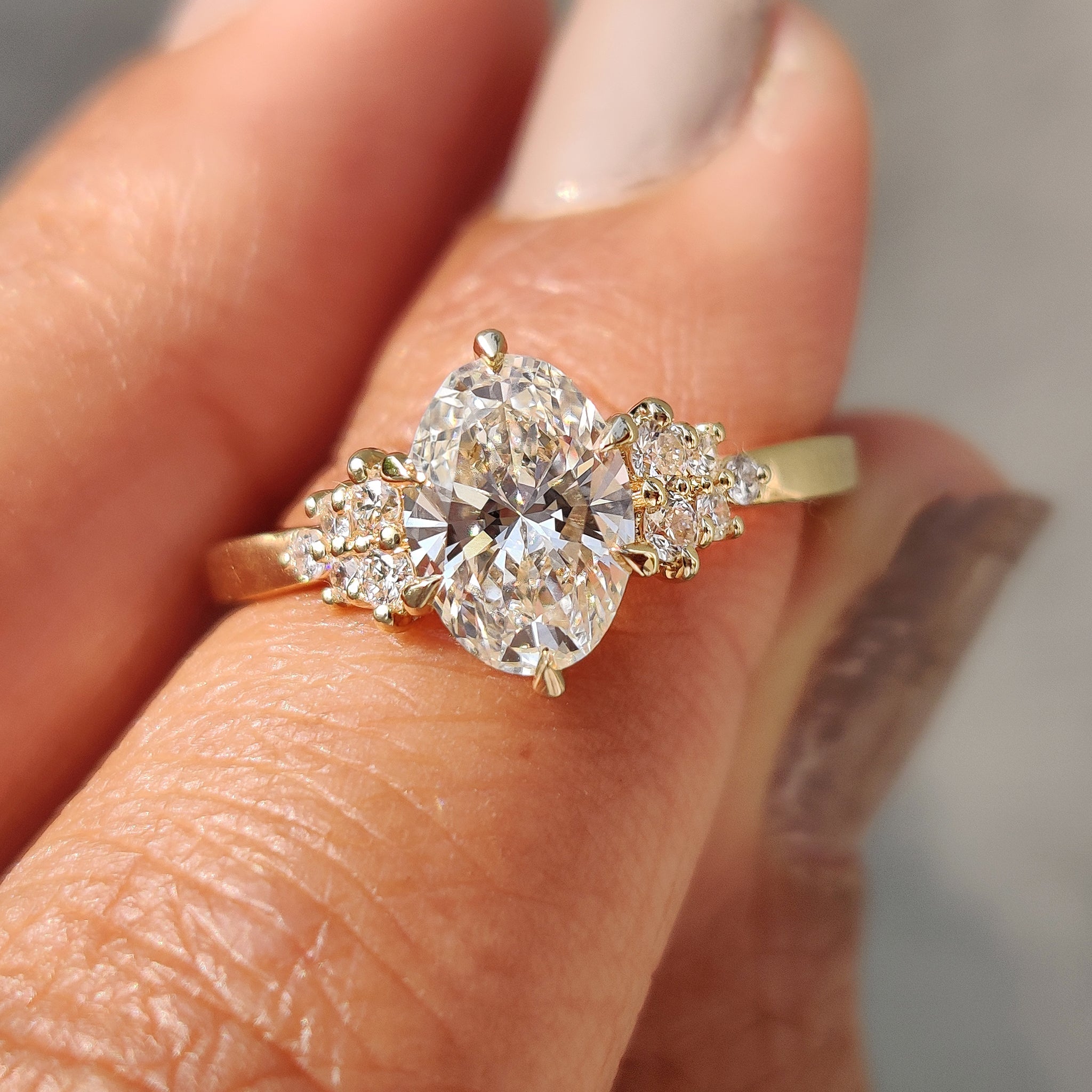 Oval Cut Engagement Ring In Cluster Setting