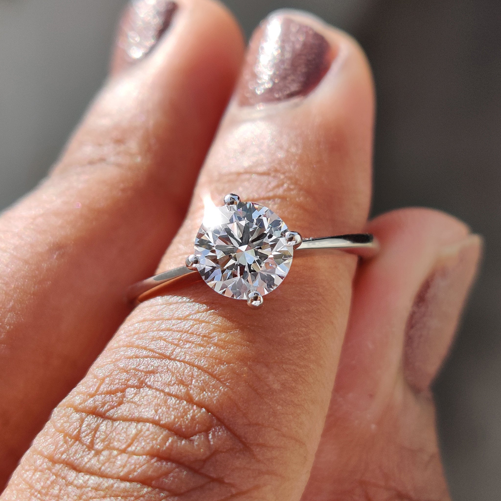 Round Solitaire Engagement Ring With Tapered Shank Design Main image
