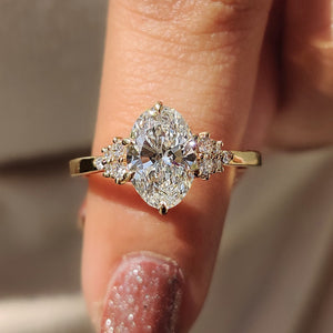 Oval Diamond Ring With Round Cut Side Stone