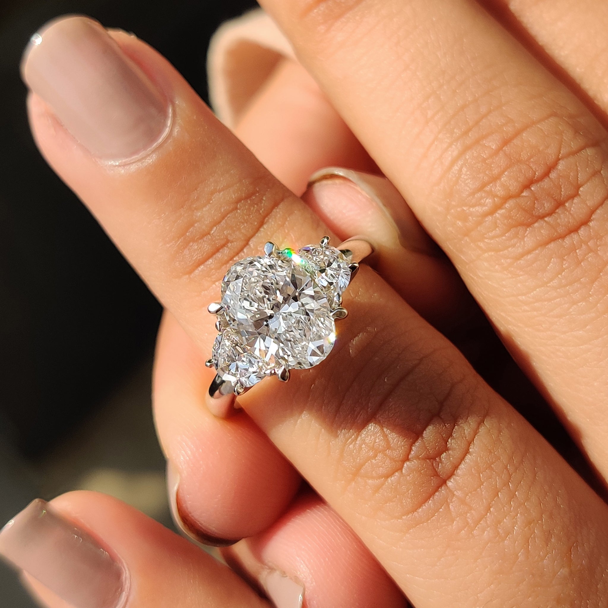 Three Stone Oval Engagement Ring With Half Moon Cut Main image