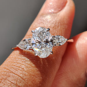 3 Stone Engagement Ring With Oval and Pear Cut Diamond