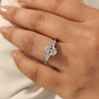 Oval Cut Diamond Ring with Round Side Stones