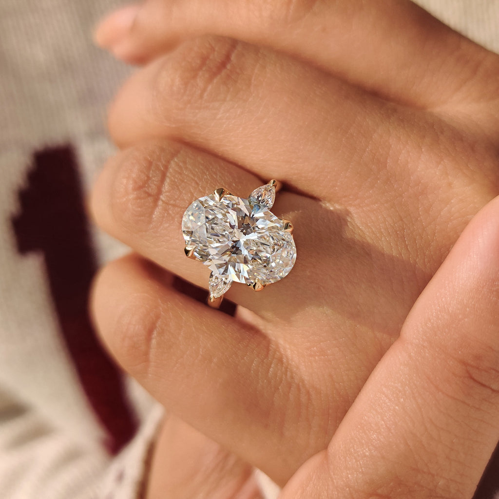 Oval Diamond Three Stone Engagement Ring With Pear Side Stone