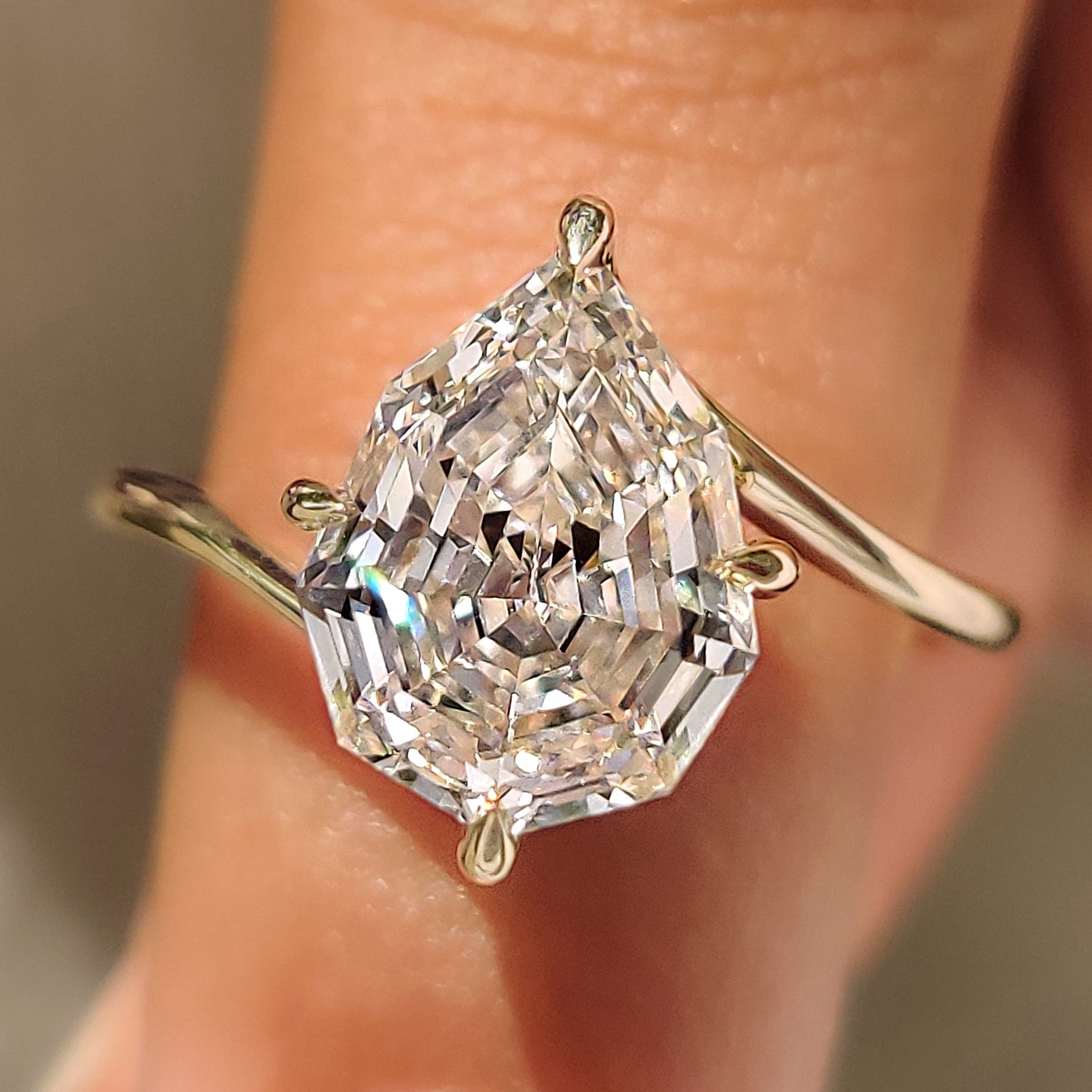 Pear Step Cut Diamond Solitaire Engagement Ring in Bypass Setting