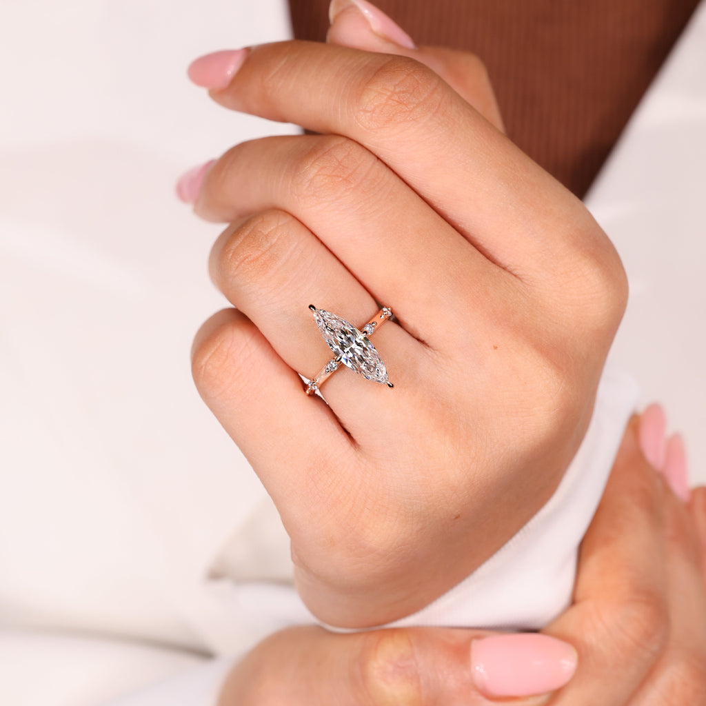Elongated Marquise Engagement Ring In Distance Pave Style