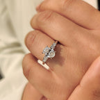 Oval Cut Diamond Ring with Round Side Stones