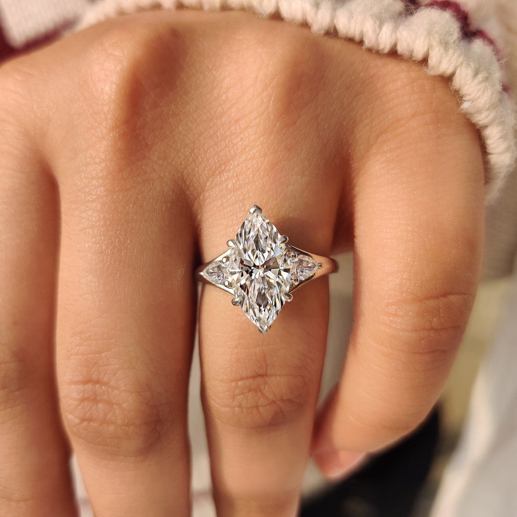 Three Stone Marquise Diamond Ring with Pear Side Diamond