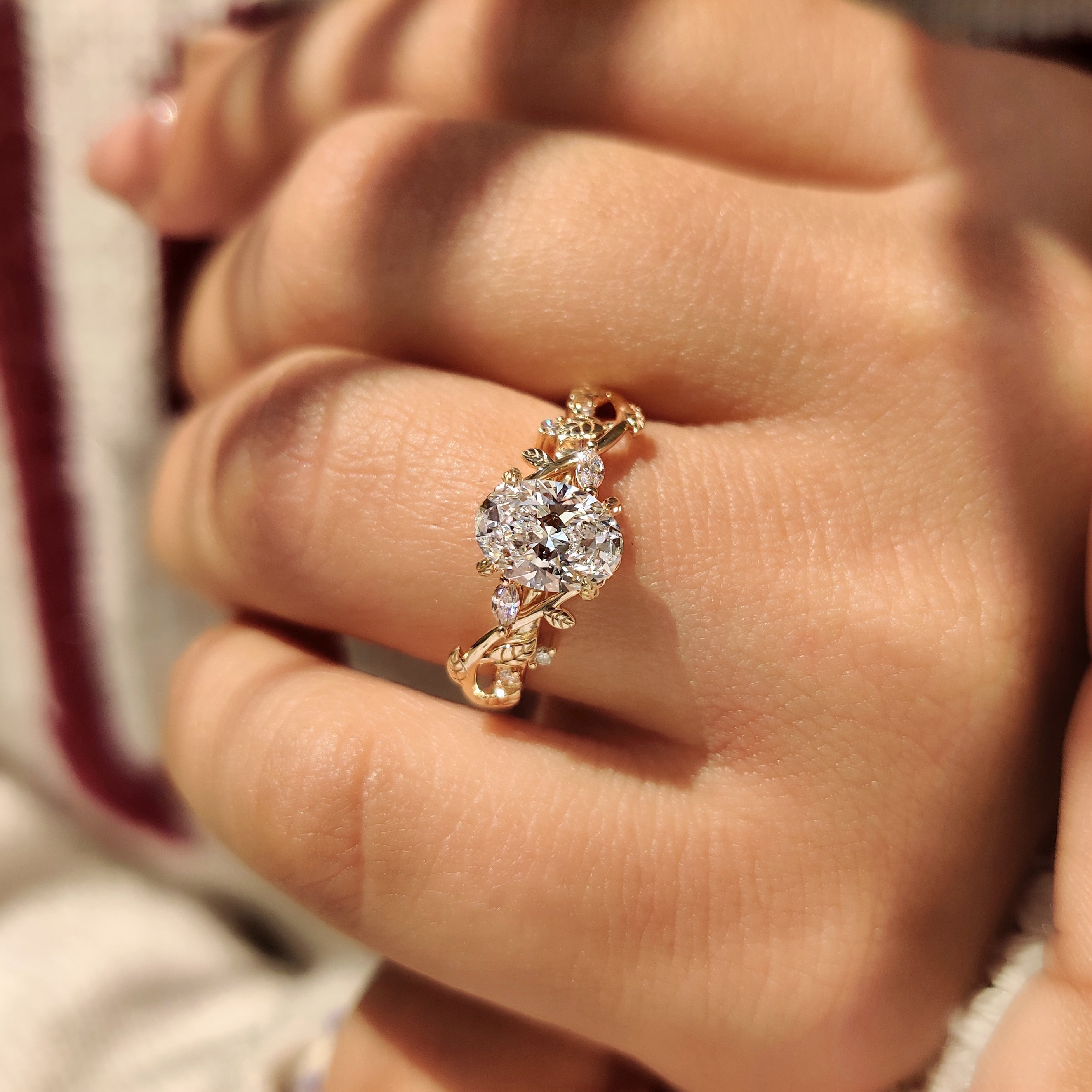 Nature Inspired Oval Diamond Ring with Leaf Style Prong Setting