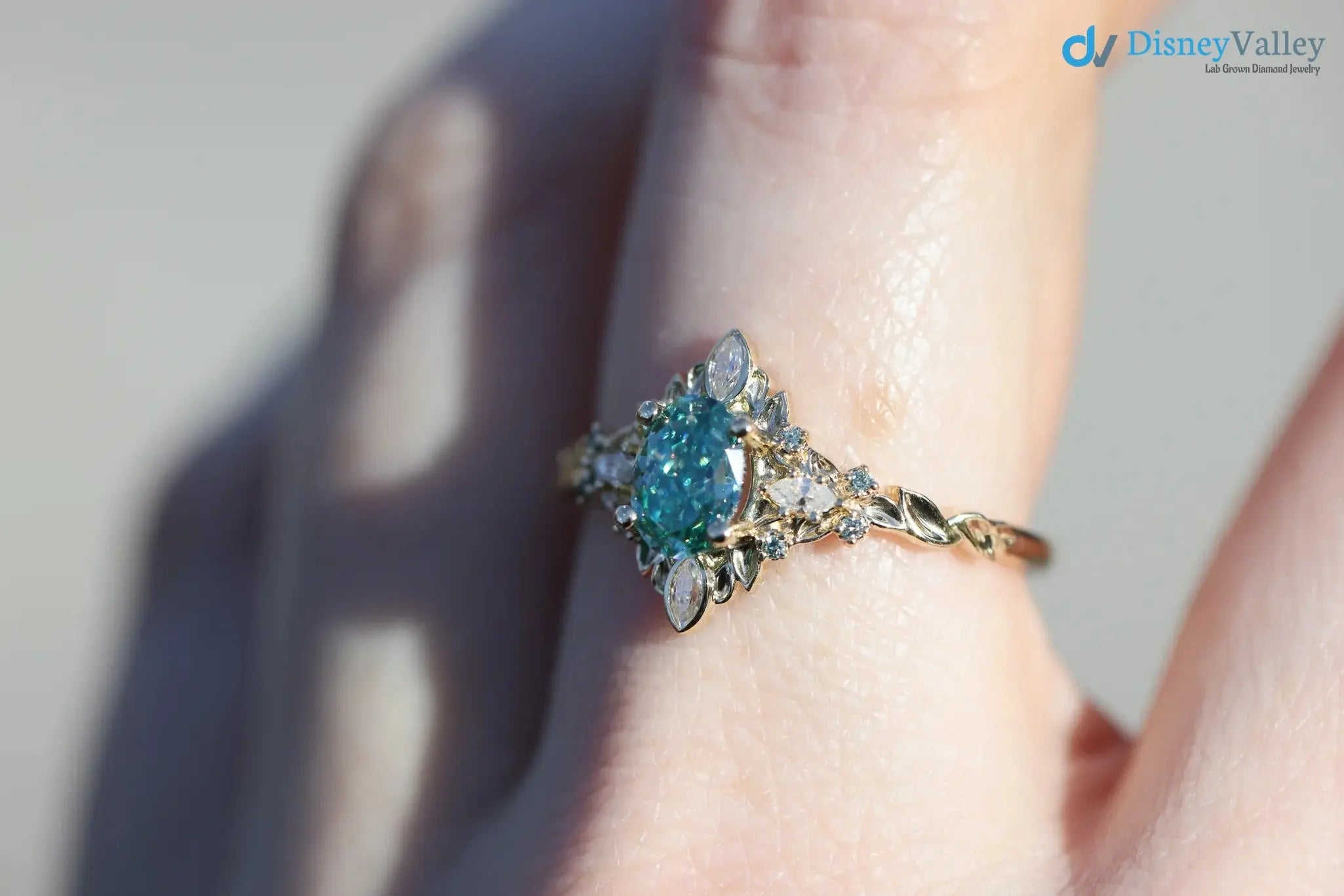 Galadriel with 7x5mm oval teal marquise cut lab grown engagement ring DisneyValley