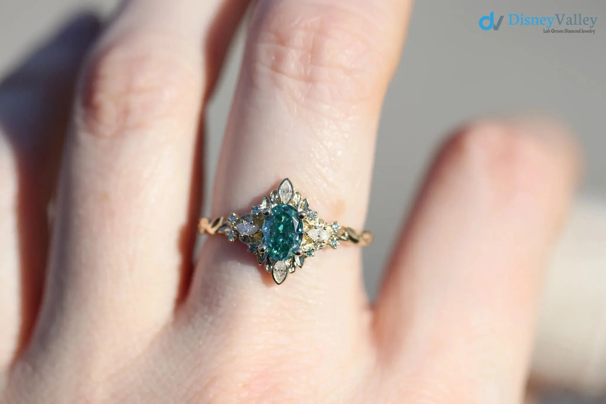 Galadriel with 7x5mm oval teal marquise cut lab grown engagement ring DisneyValley