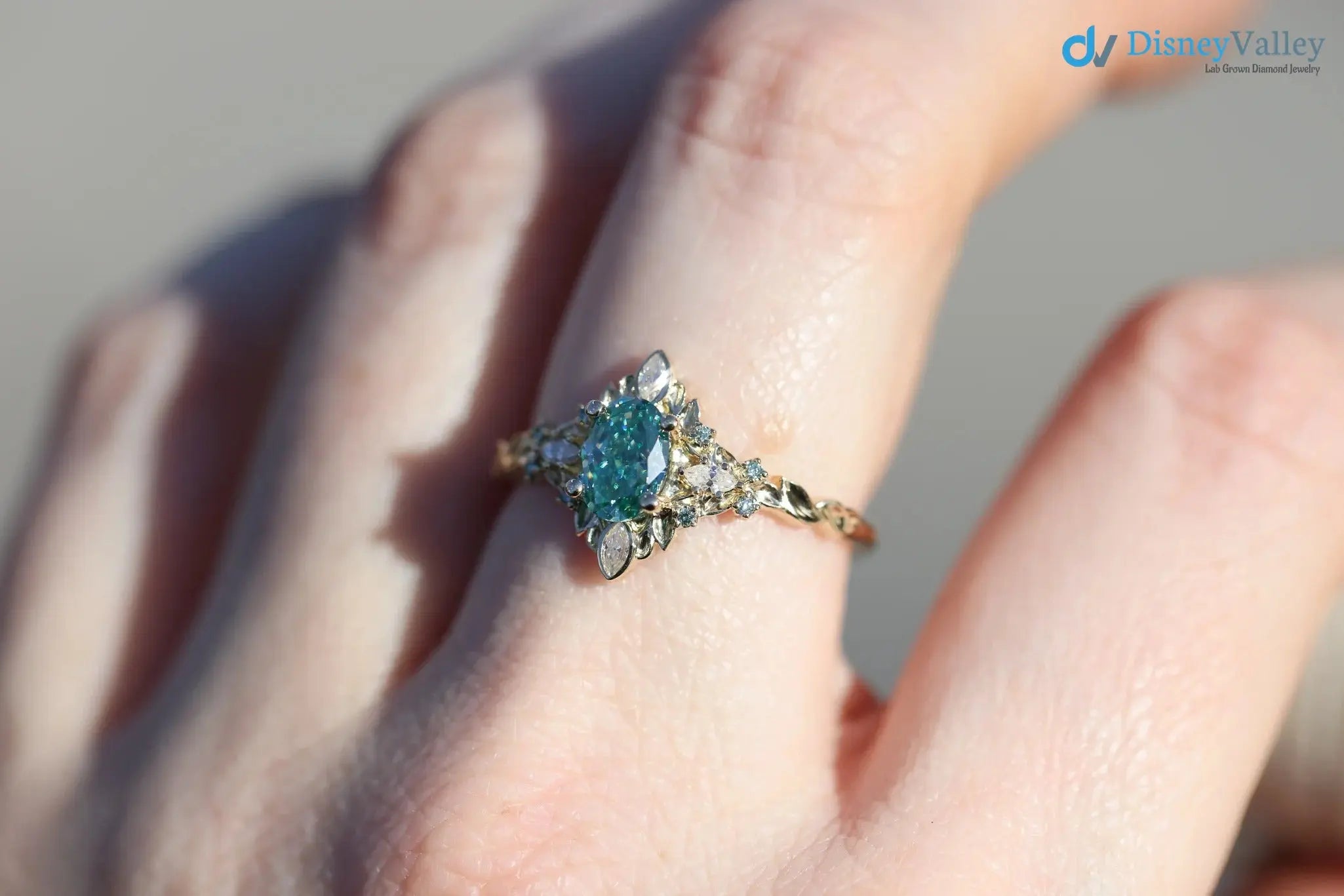 Galadriel with 7x5mm oval teal marquise cut lab grown engagement ring DisneyValley