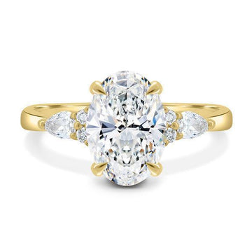 1.6ct Oval cut moissanite Trilogy with Round and Pear cluster engagement rings