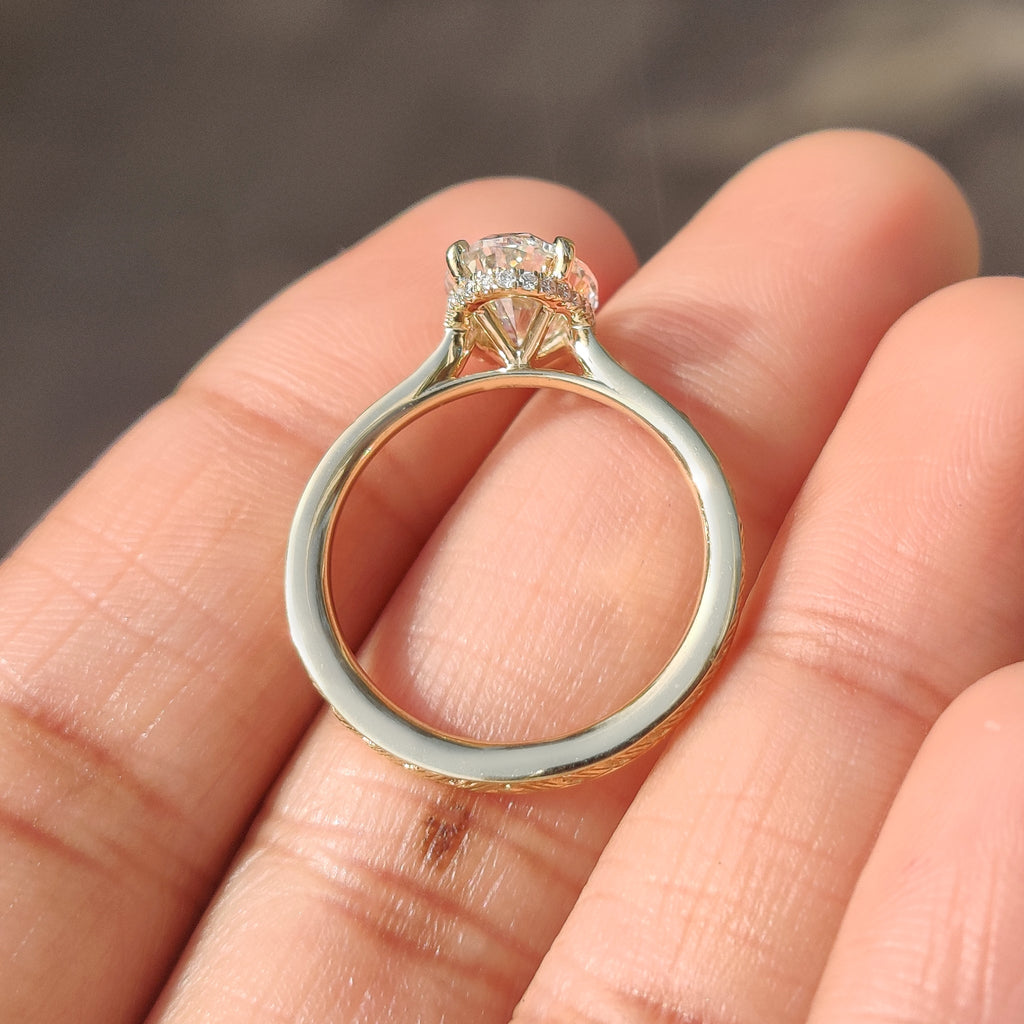 Oval Cut Art Deco Diamond Ring with Two Emerald Side Gemstones