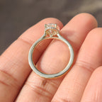 Oval Cut Art Deco Diamond Ring with Two Emerald Side Gemstones