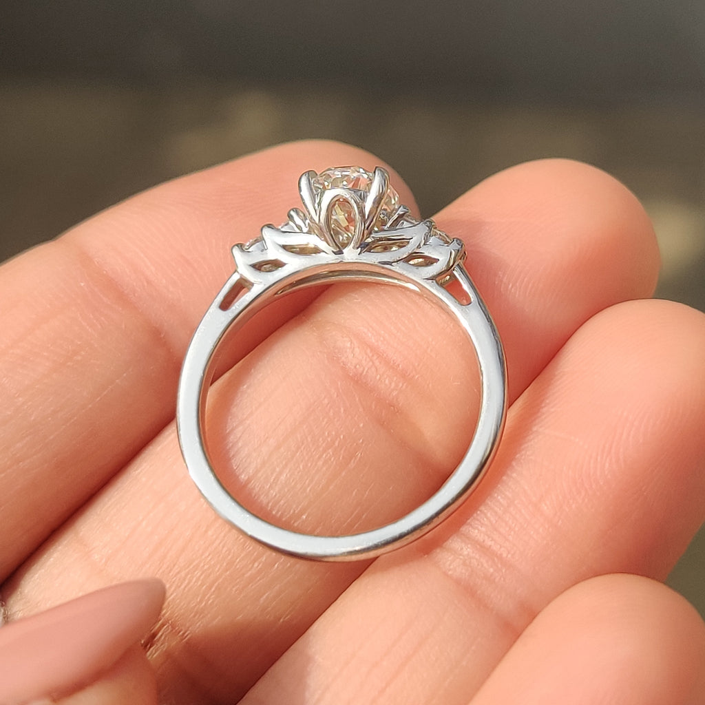Oval Cut Diamond Ring with Round Side Stones
