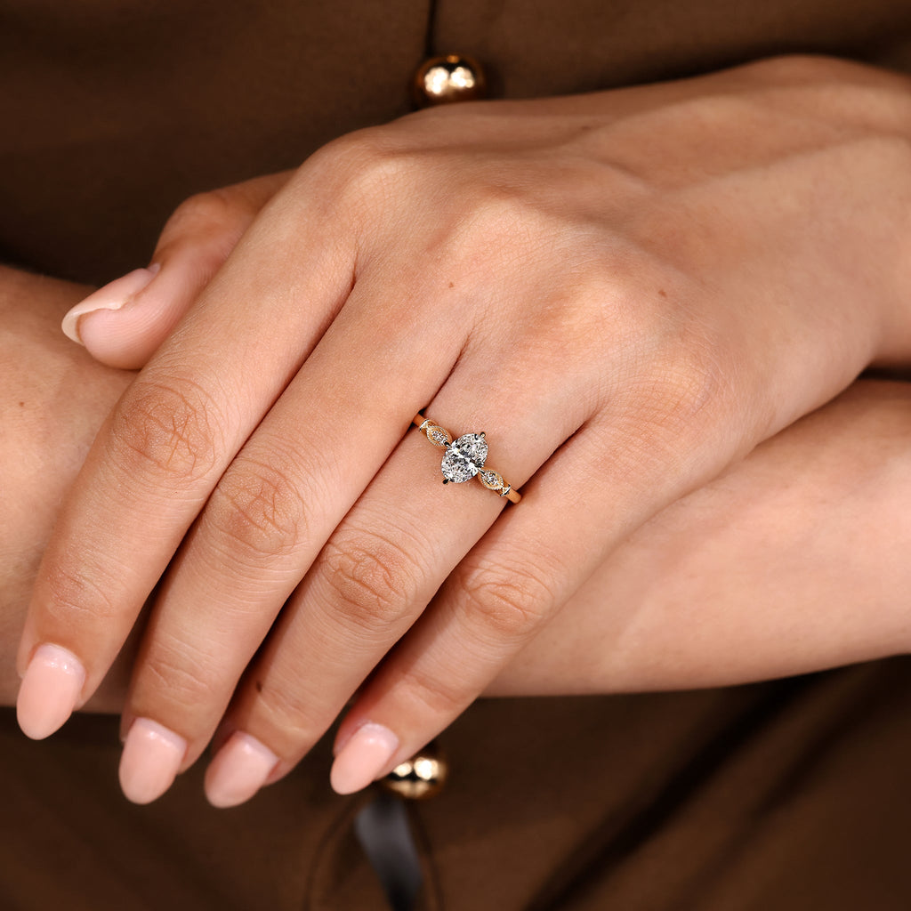 Oval Cut Diamond Ring With Round Side Stone Style