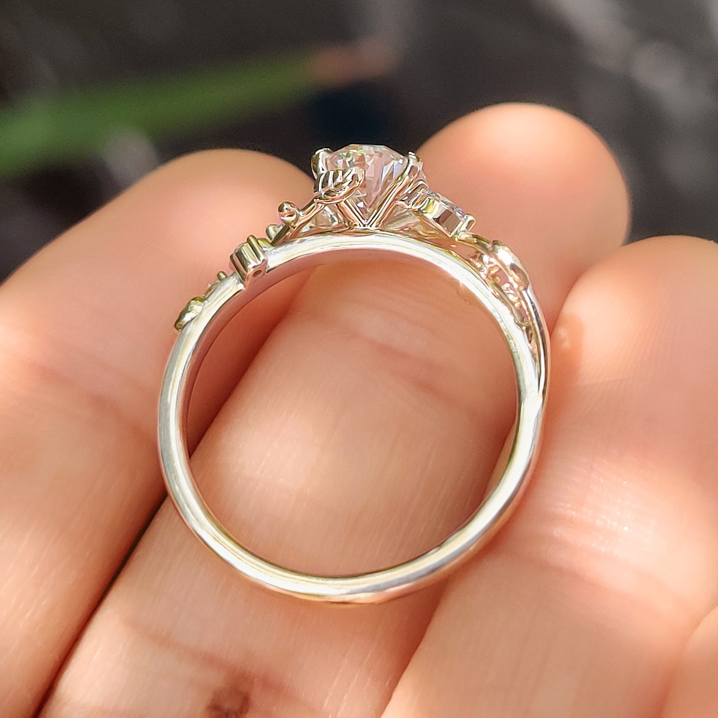 Nature Inspired Oval Diamond Ring with Leaf Style Prong Setting