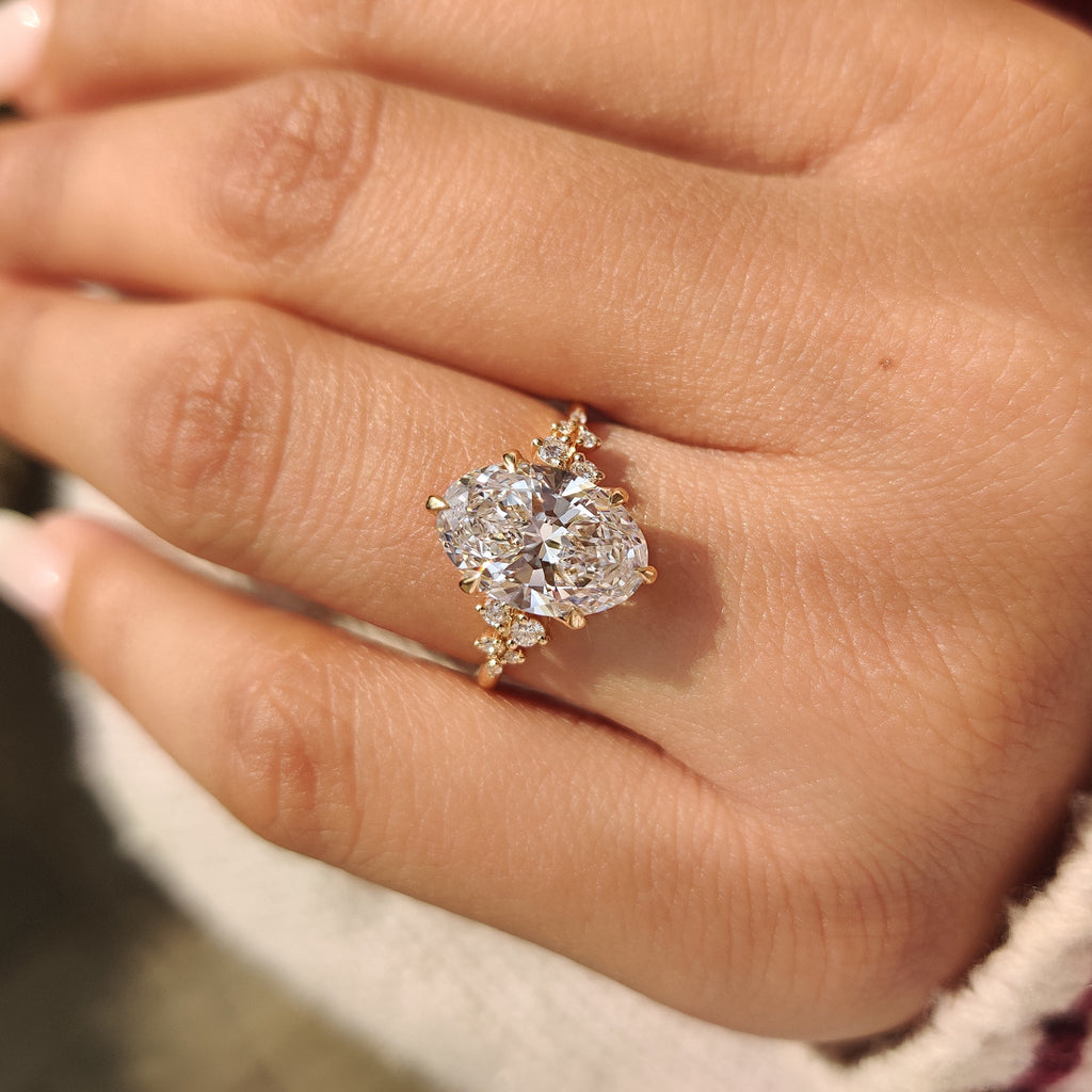Oval Diamond Ring With Round Side Stones