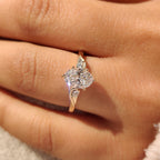 Three Stone Style Oval Cut Engagement Ring with Round Side Stone