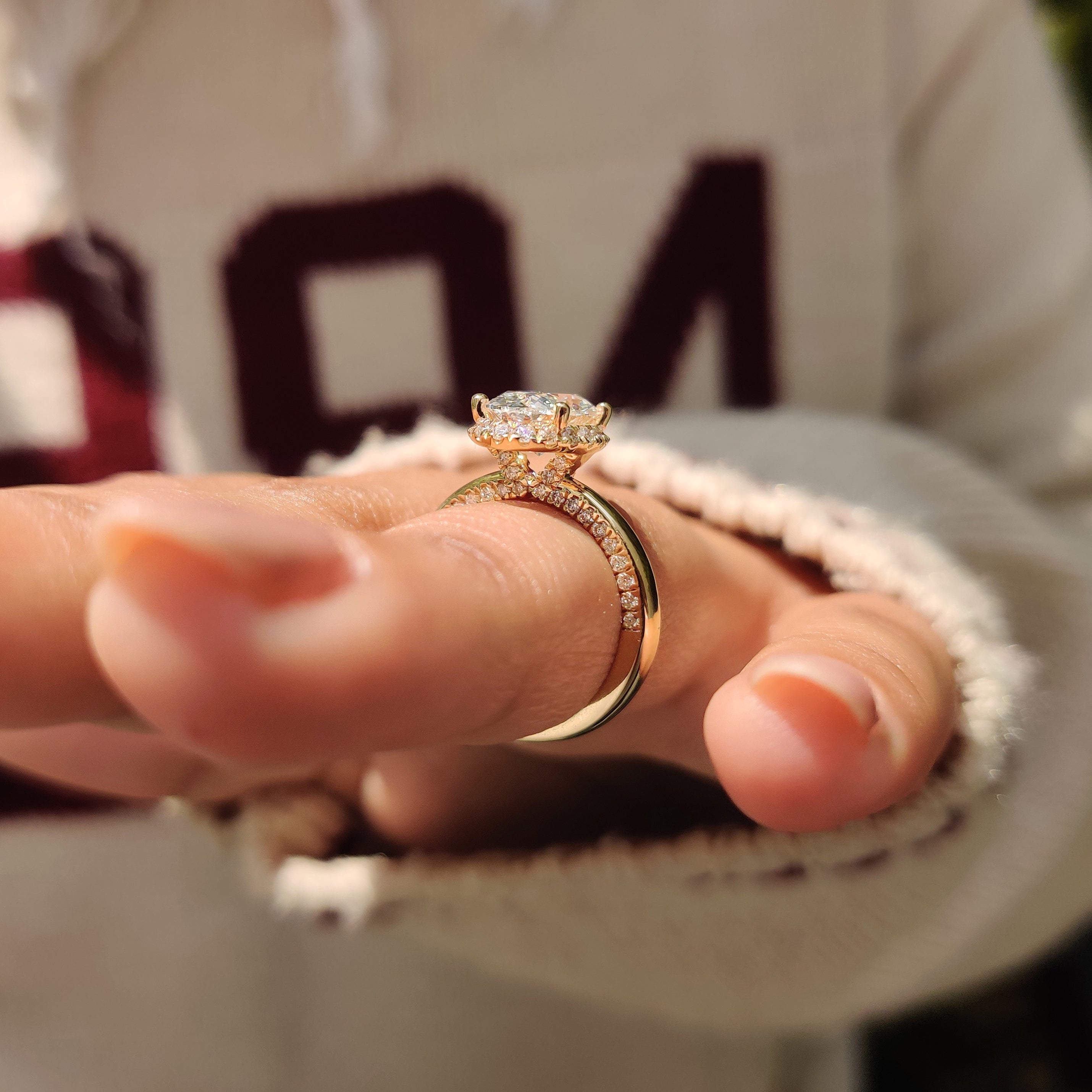 Oval Cut Diamond Ring in Round Cut Diamond Basket Setting