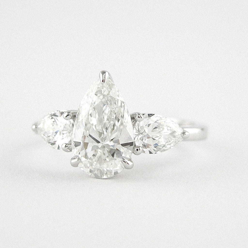 1.50 CT Pear Cut Moissanite 3 Stone Engagement Ring in 14K White Gold