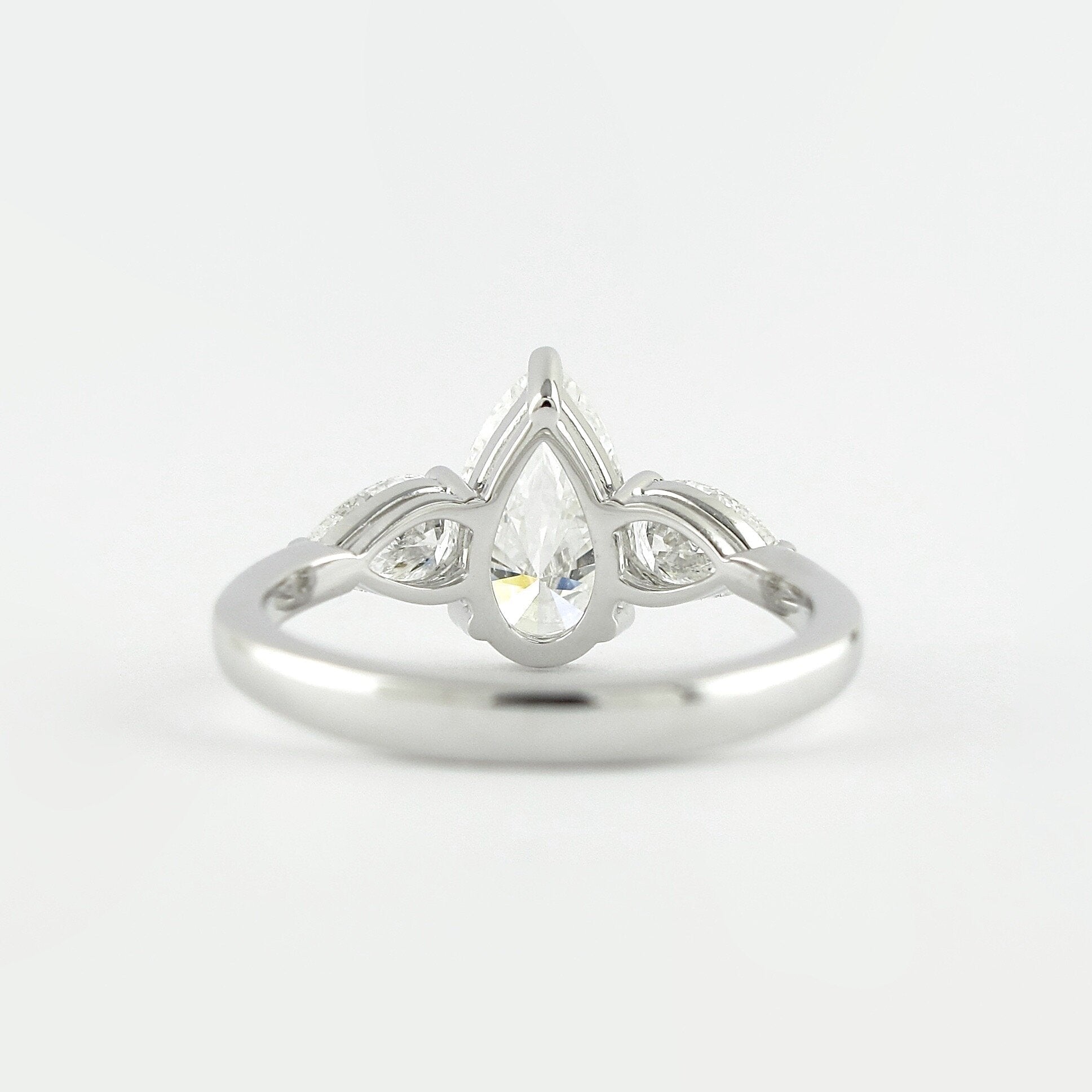 1.50 CT Pear Cut Moissanite 3 Stone Engagement Ring in 14K White Gold