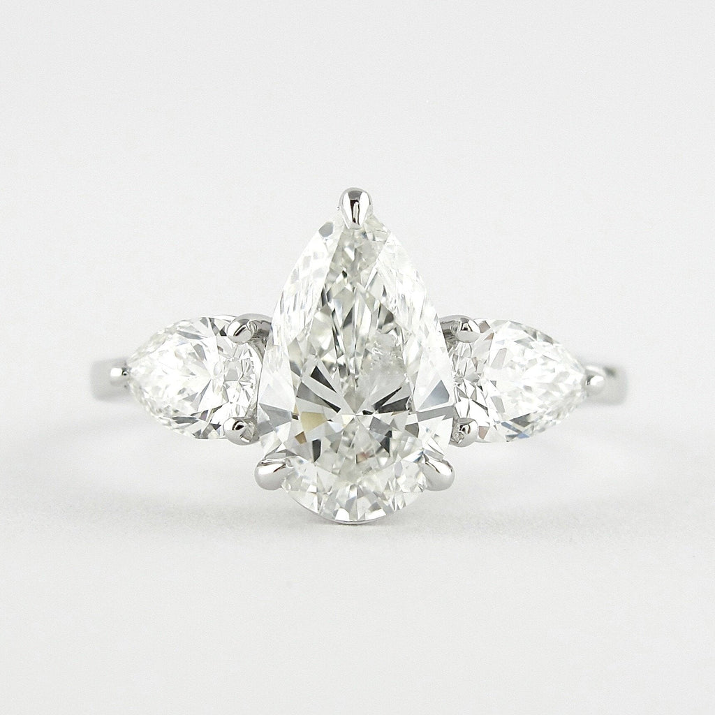 1.50 CT Pear Cut Moissanite 3 Stone Engagement Ring in 14K White Gold
