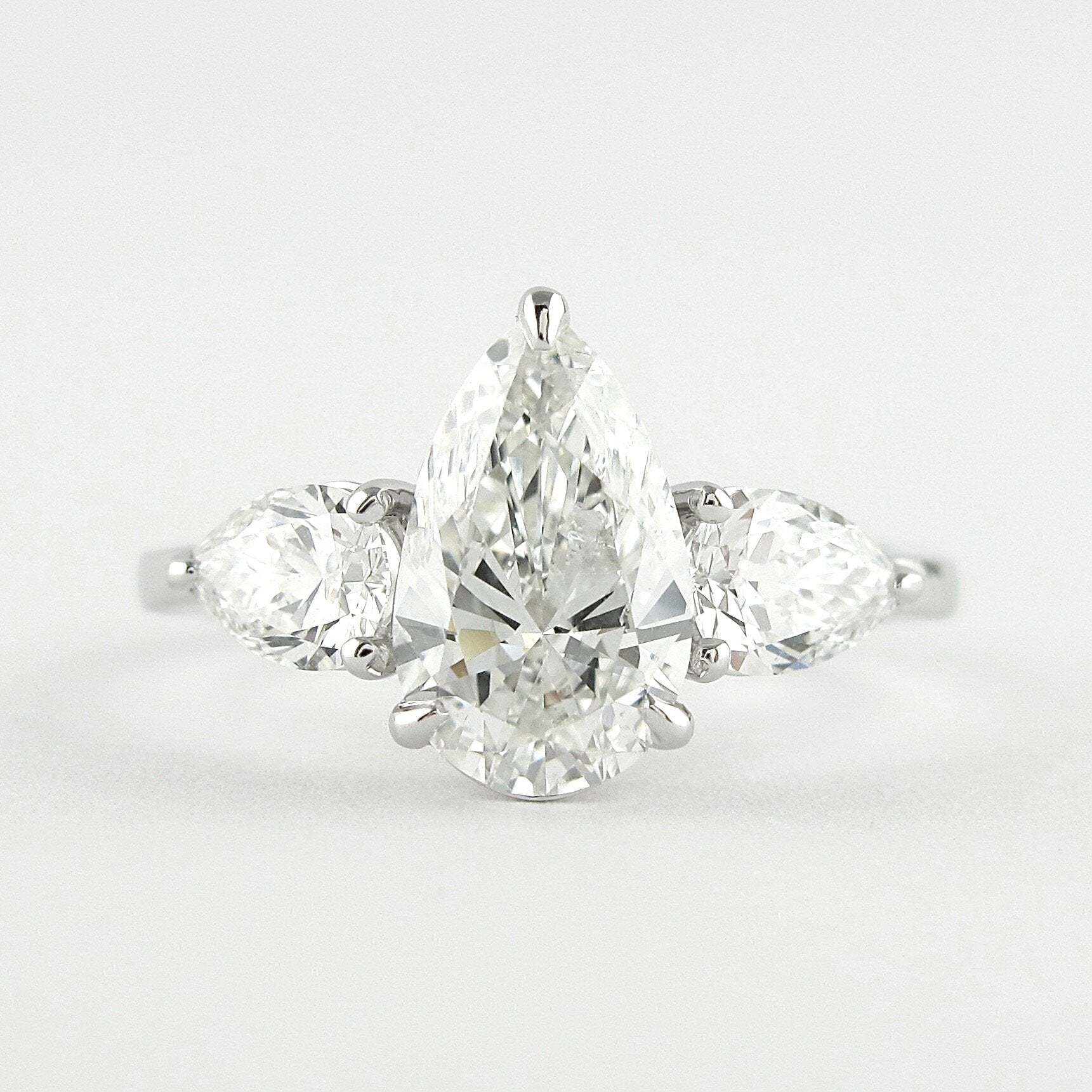 1.50 CT Pear Cut Moissanite 3 Stone Engagement Ring in 14K White Gold