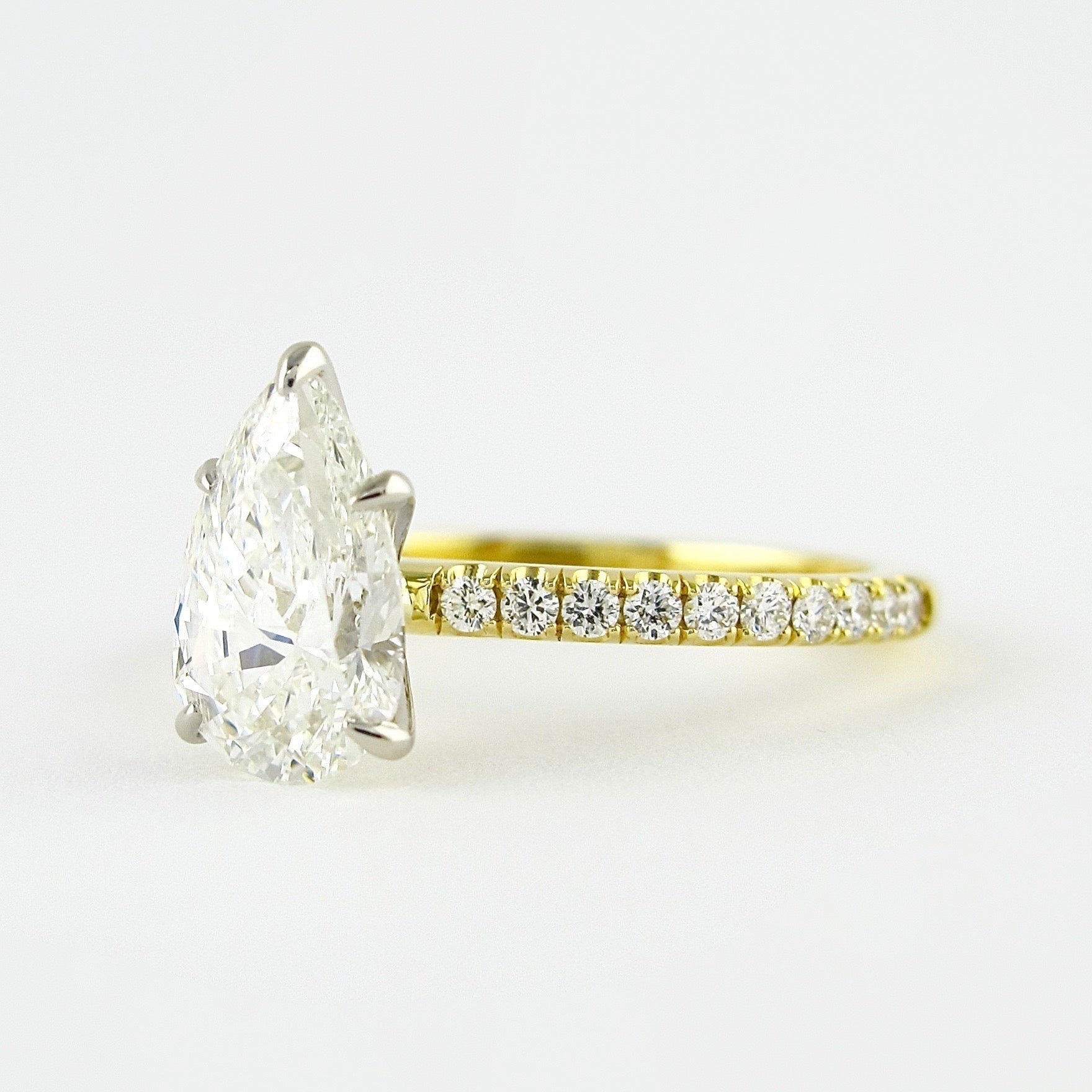0.94 CT Pear Cut Moissanite Pave Style Engagement Ring